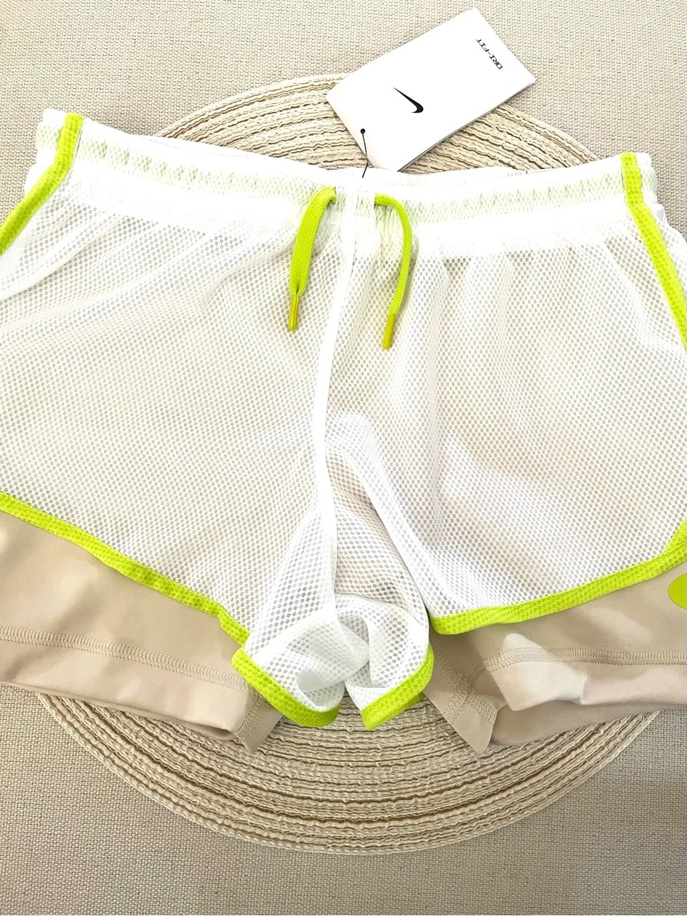 Nike Beige Sports Shorts with White Mesh Overlay and Neon Green Trim